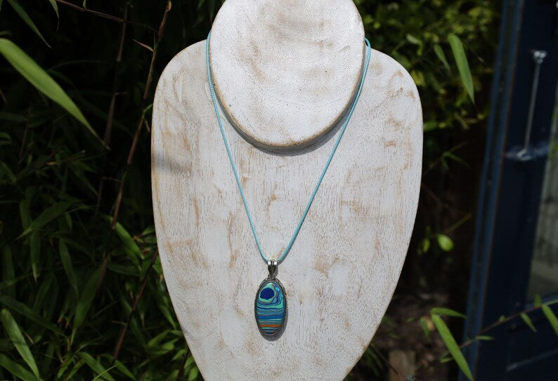 Rainbow Calsilica 925 Silver Plated Handmade Pendant. Rainbow calsilica is a colorful and intriguing material often used in jewelry and decorative objects