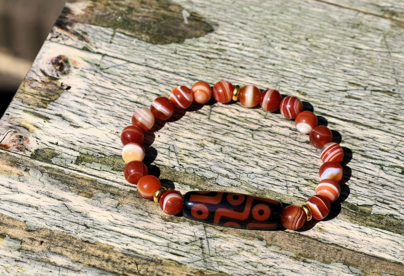 Nine-eye dZi bead with beautiful Orange striped agate beads. The Star of Prosperity and the Heaven Protection