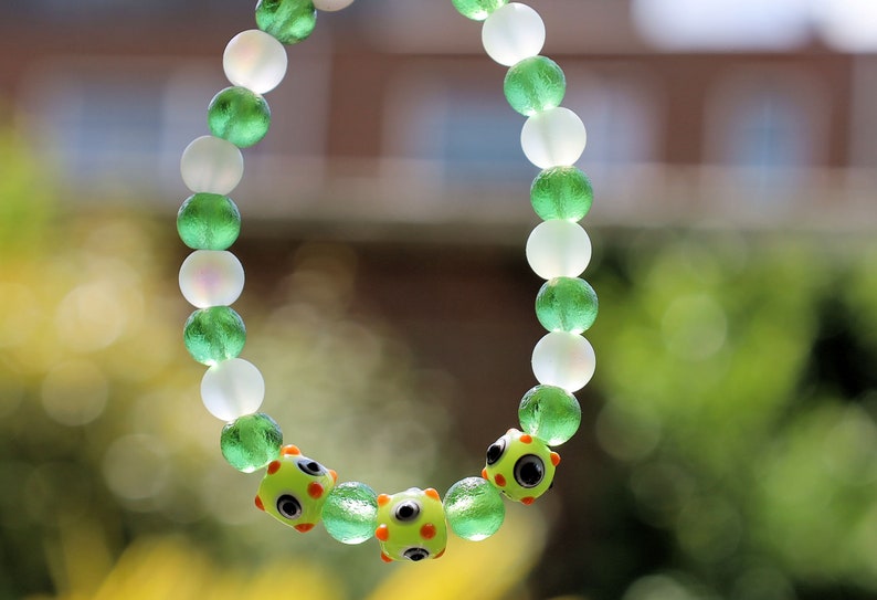 Beautiful Moldavite 8 mm and Frosted Glitter Glass and green Lampwork bead bumps. Wajakaa, one of a kind, unique and stylish