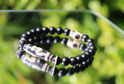 Nectar vesse" Dzi bead with Matte onyx beads and 3 medicine dzi beads. helping to balance the body's energies