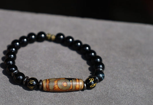 Three-eye dZi bead with black onyx beads and With Agate Om mani padme hum beads. jewel in the lotus.
