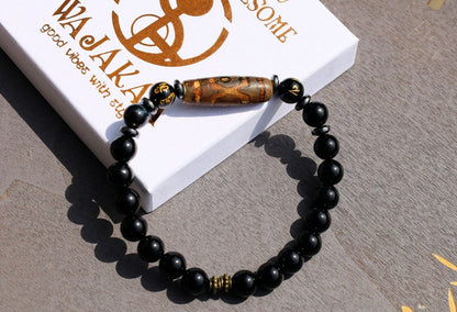 Three-eye dZi bead with black onyx beads and With Agate Om mani padme hum beads. jewel in the lotus.