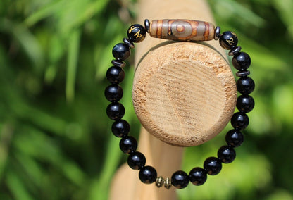 Three-eye dZi bead with black onyx beads and With Agate Om mani padme hum beads. jewel in the lotus.