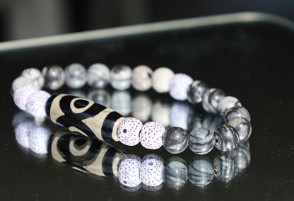 Three-eye dZi bead with  Starmoon Bodhi Barrel Beads and Black silk stone beads. This is one of the most powerful beads