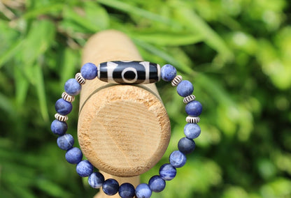 Three-eye dZi bead with   Blue Jasper and 6x Chevron-style tradebeads. connects you to the spiritual world.