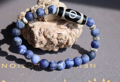 Three-eye dZi bead with   Blue Jasper and 6x Chevron-style tradebeads. connects you to the spiritual world.