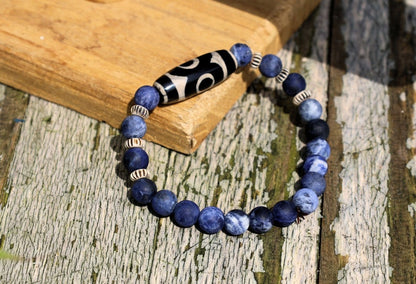 Three-eye dZi bead with   Blue Jasper and 6x Chevron-style tradebeads. connects you to the spiritual world.