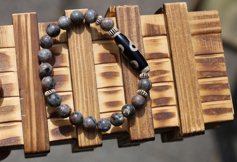 Seven-eye dZi bead with Yooperlite is a new crystal that was recently discovered in lake Superior near Michigan. And Chevron beads