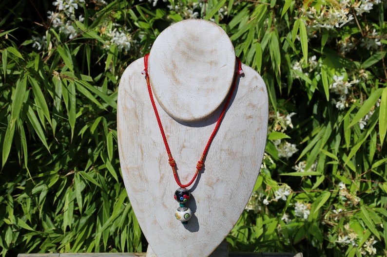 Introducing our exquisite Double Handmade Tibetan Style Round Beads Necklace, featuring a unique blend of craftsmanship and tradition