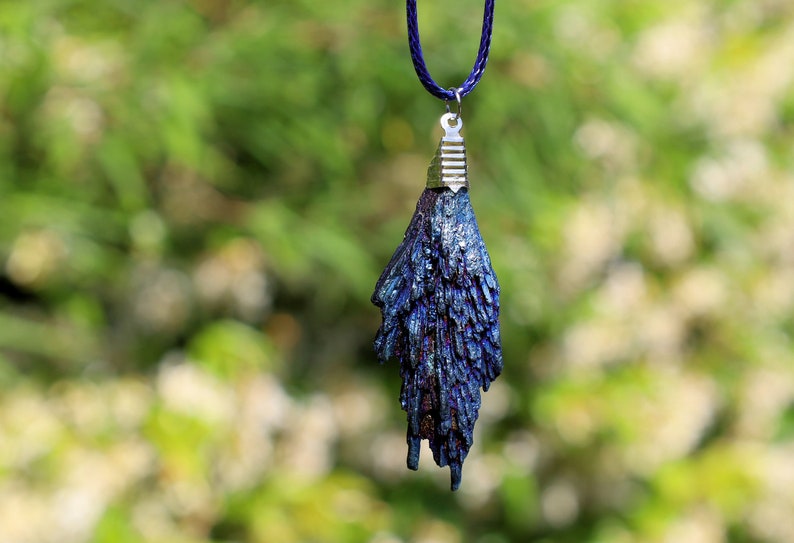 Black Tourmaline and Blue Titanium Aura Quartz Crystal, each with its own unique meanings and properties in the realm minerals