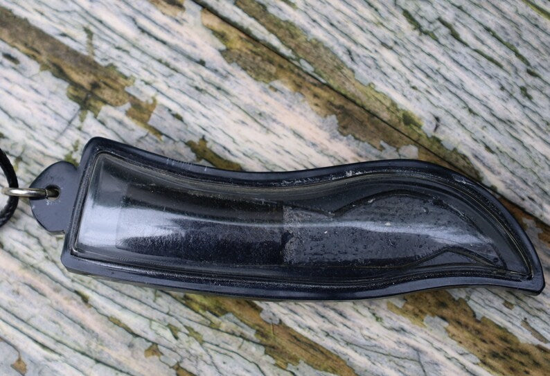 Meed Mor is a traditional Thai knife known for its spiritual and cultural significance. It is often used in rituals and ceremonies