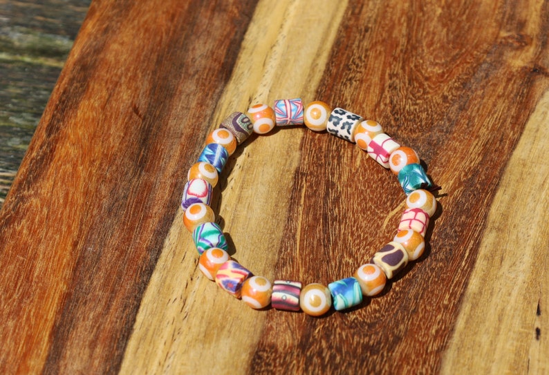 Polymer Clay Colorful  and Electroplate Glass Beads Evil eye. is believed to absorb negative energy or deflect.