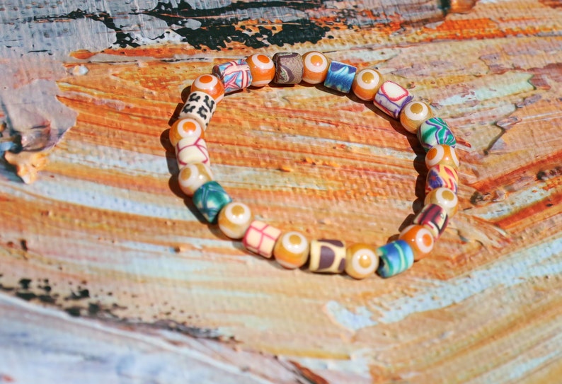 Polymer Clay Colorful  and Electroplate Glass Beads Evil eye. is believed to absorb negative energy or deflect.