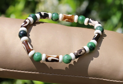 Unique and Artistic Epidote ruby bracelet with Black and white Tribal Tube Bone Beads. Made in India