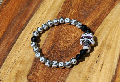 One-of-a-kind  Colorful acrylic skull  and Electroplate Glass beads with  Onyx is associated with grounding energy.