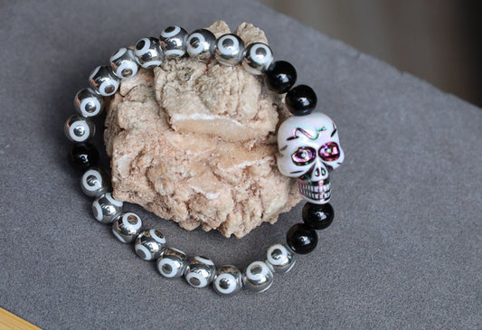 One-of-a-kind  Colorful acrylic skull  and Electroplate Glass beads with  Onyx is associated with grounding energy.