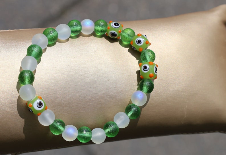 Beautiful Moldavite 8 mm and Frosted Glitter Glass and green Lampwork bead bumps. Wajakaa, one of a kind, unique and stylish
