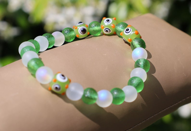 Beautiful Moldavite 8 mm and Frosted Glitter Glass and green Lampwork bead bumps. Wajakaa, one of a kind, unique and stylish