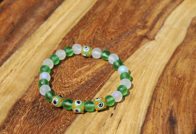 Beautiful Moldavite 8 mm and Frosted Glitter Glass and green Lampwork bead bumps. Wajakaa, one of a kind, unique and stylish