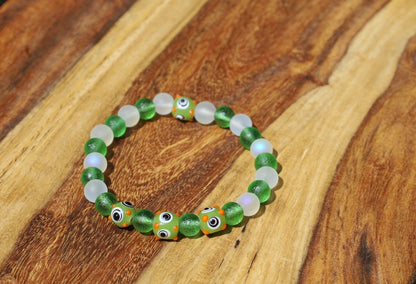 Beautiful Moldavite 8 mm and Frosted Glitter Glass and green Lampwork bead bumps. Wajakaa, one of a kind, unique and stylish