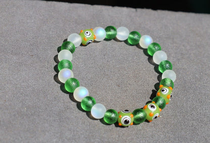 Beautiful Moldavite 8 mm and Frosted Glitter Glass and green Lampwork bead bumps. Wajakaa, one of a kind, unique and stylish
