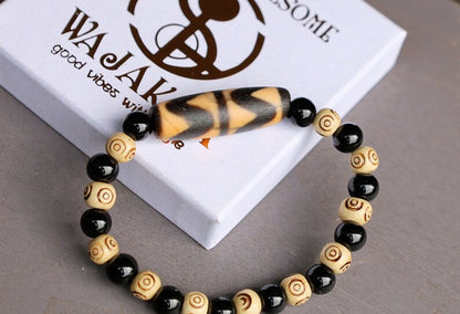 Old Double DZI Tiger’s Teeth Bracelet with  Onyx and Spiral beads. Visually striking with profound spiritual significance.