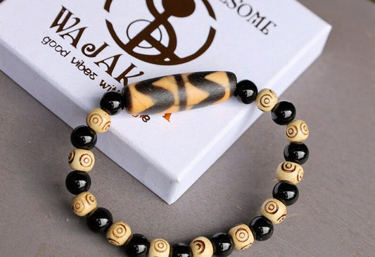 Old Double DZI Tiger’s Teeth Bracelet with  Onyx and Spiral beads. Visually striking with profound spiritual significance.