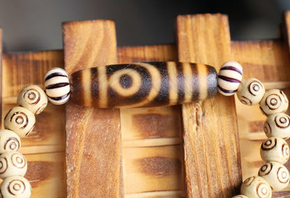 Old Two-eye dZi bead Bracelet with  and Spiral pattern beads. Visually striking with profound spiritual significance.