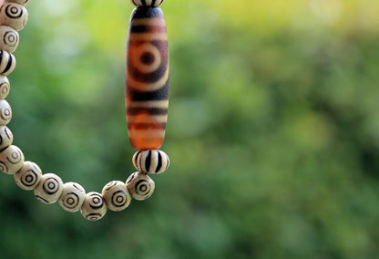 Old Two-eye dZi bead Bracelet with  and Spiral pattern beads. Visually striking with profound spiritual significance.