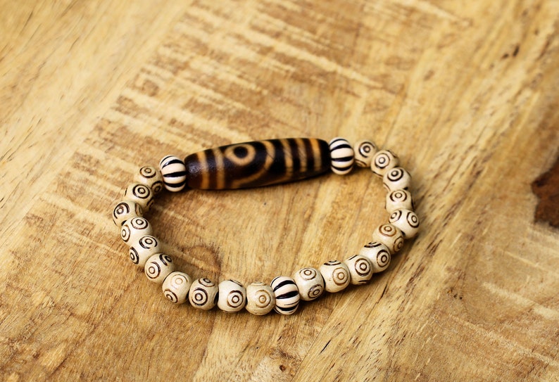 Old Two-eye dZi bead Bracelet with  and Spiral pattern beads. Visually striking with profound spiritual significance.