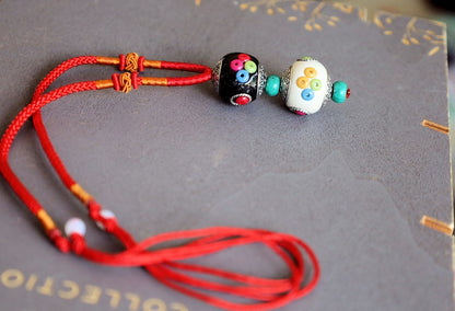 Introducing our exquisite Double Handmade Tibetan Style Round Beads Necklace, featuring a unique blend of craftsmanship and tradition
