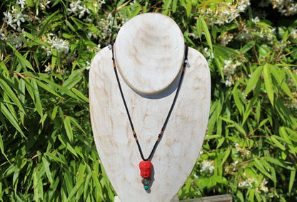A beautiful large, handcrafted bead of real red Cinnabar Buddha with prayerbead from Nepal and Tibetan turquoise buddhist prayer bead
