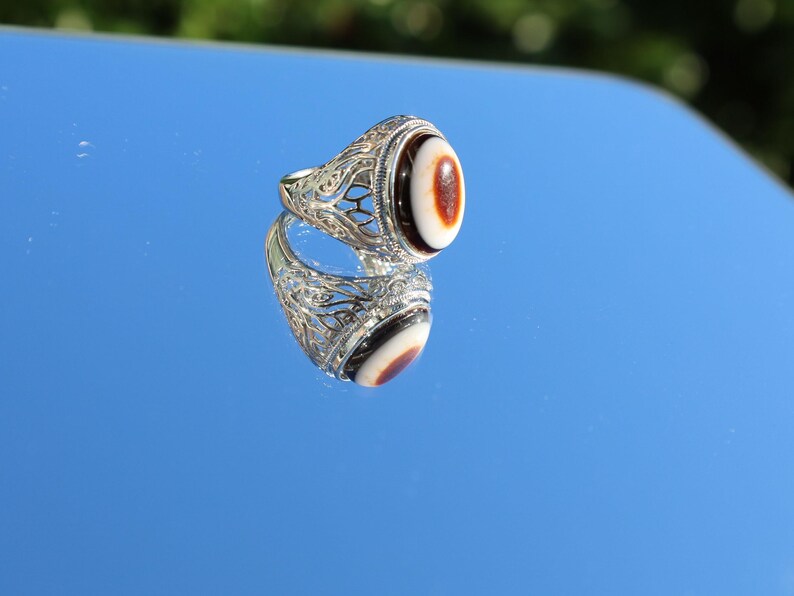 Handmade Tibetan Evil-Eye dZi Bead Ring. This ring is ideal for those seeking both style and spiritual protection.