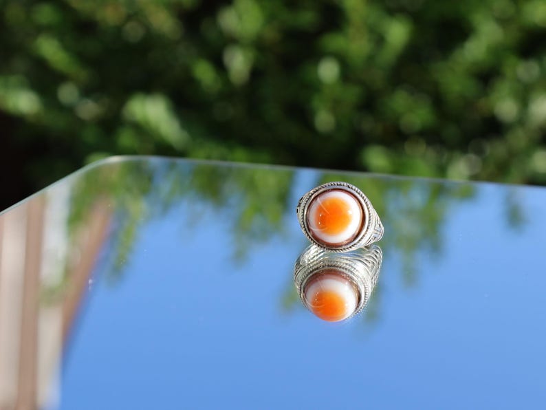 Handmade Tibetan Evil-Eye dZi Bead Ring. This ring is ideal for those seeking both style and spiritual protection.