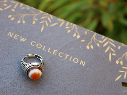 Handmade Tibetan Evil-Eye dZi Bead Ring. This ring is ideal for those seeking both style and spiritual protection.