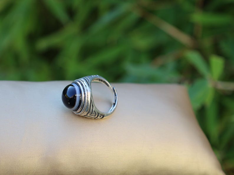 Handmade Tibetan Evil-Eye dZi Bead Ring. This ring is ideal for those seeking both style and spiritual protection.