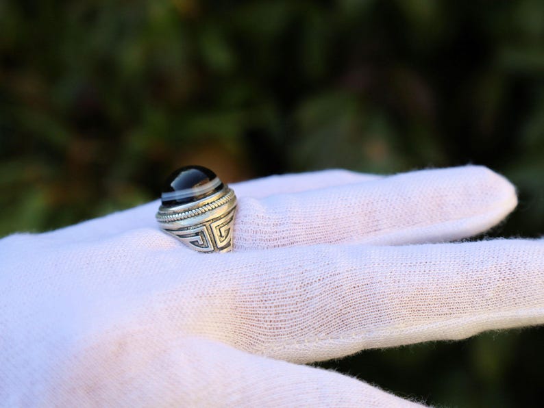 Handmade Tibetan Evil-Eye dZi Bead Ring. This ring is ideal for those seeking both style and spiritual protection.