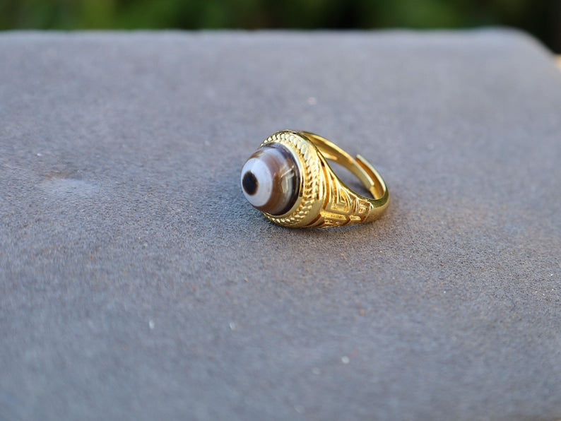 Handmade Tibetan Evil-Eye dZi Bead Ring. This ring is ideal for those seeking both style and spiritual protection.