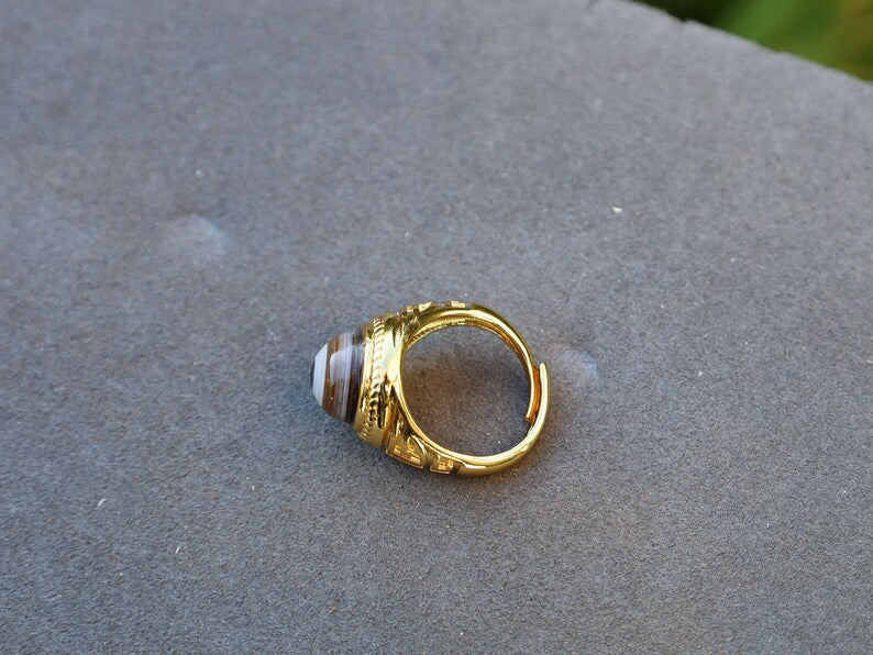 Handmade Tibetan Evil-Eye dZi Bead Ring. This ring is ideal for those seeking both style and spiritual protection.