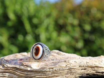 Handmade Tibetan Evil-Eye dZi Bead Ring. This ring is ideal for those seeking both style and spiritual protection.