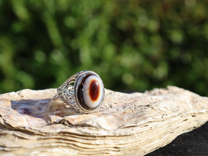 Handmade Tibetan Evil-Eye dZi Bead Ring. This ring is ideal for those seeking both style and spiritual protection.
