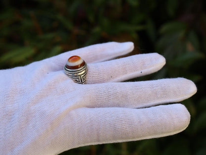 Handmade Tibetan Evil-Eye dZi Bead Ring. This ring is ideal for those seeking both style and spiritual protection.