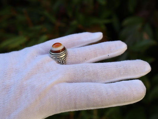 Handmade Tibetan Evil-Eye dZi Bead Ring. This ring is ideal for those seeking both style and spiritual protection.