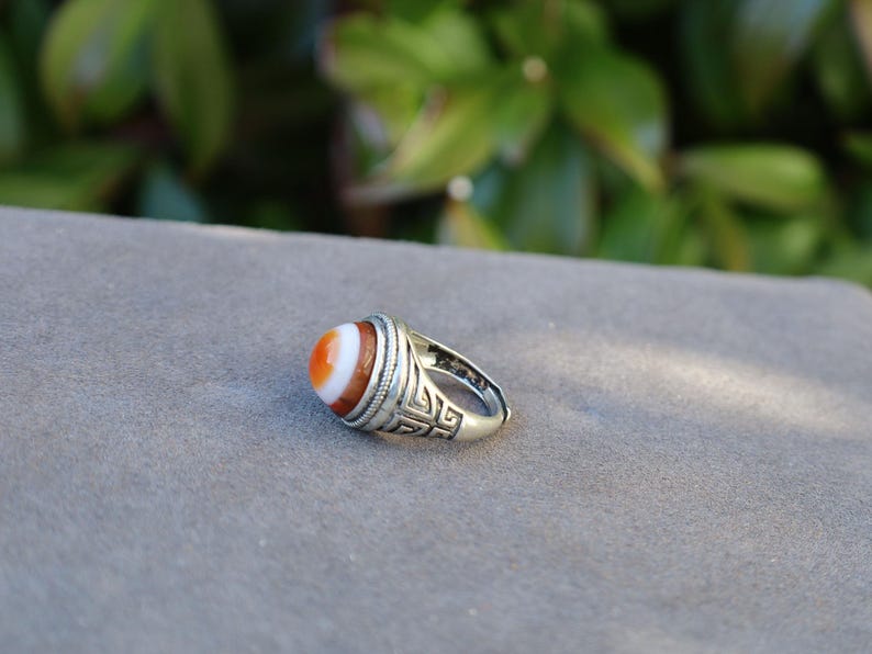 Handmade Tibetan Evil-Eye dZi Bead Ring. This ring is ideal for those seeking both style and spiritual protection.