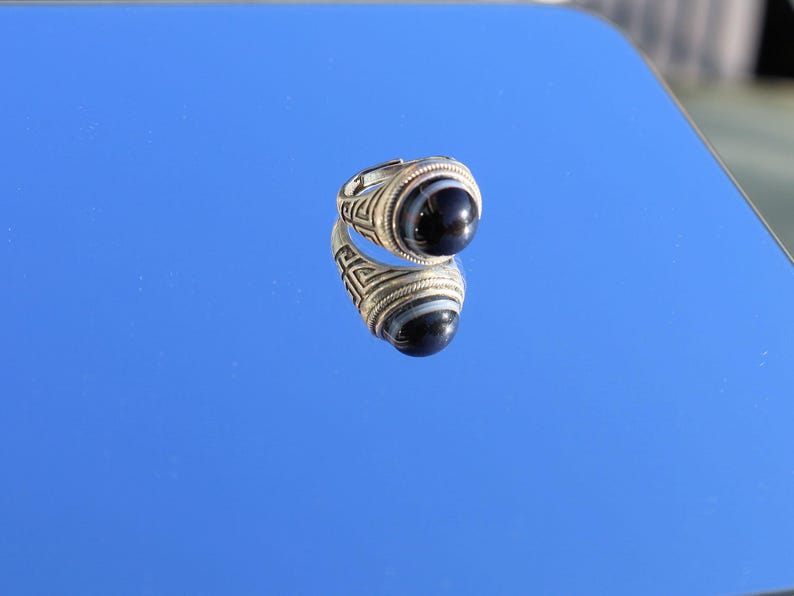 Handmade Tibetan Evil-Eye dZi Bead Ring. This ring is ideal for those seeking both style and spiritual protection.