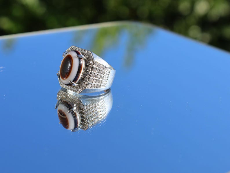 Handmade Tibetan Evil-Eye dZi Bead Ring. This ring is ideal for those seeking both style and spiritual protection.