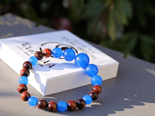 A bracelet made with Royal Blue Jade and Red Tiger Eye beads is a striking combination that blends elegance and vibrant energy.