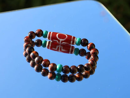Big Man (Aristocrat) dZi Bead with Red Tiger eye and Tibetan turquoise buddhist prayer beads. The beads are made of Green Turquoise paste.