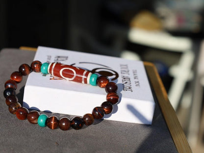 Big Man (Aristocrat) dZi Bead with Red Tiger eye and Tibetan turquoise buddhist prayer beads. The beads are made of Green Turquoise paste.