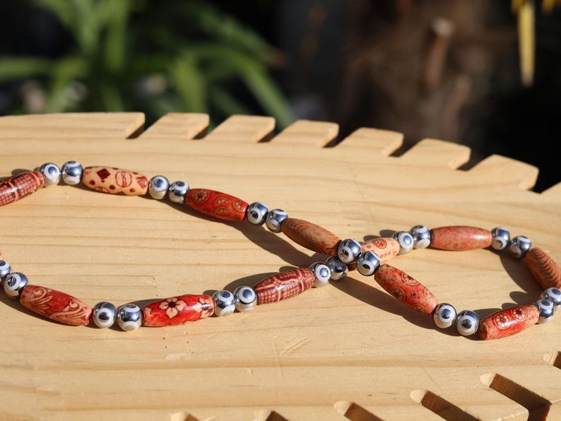 White  Electroplate Glass Beads Strands, Round with Evil Eye Pattern,Orange. Evil eye beads typically feature a design of an eye